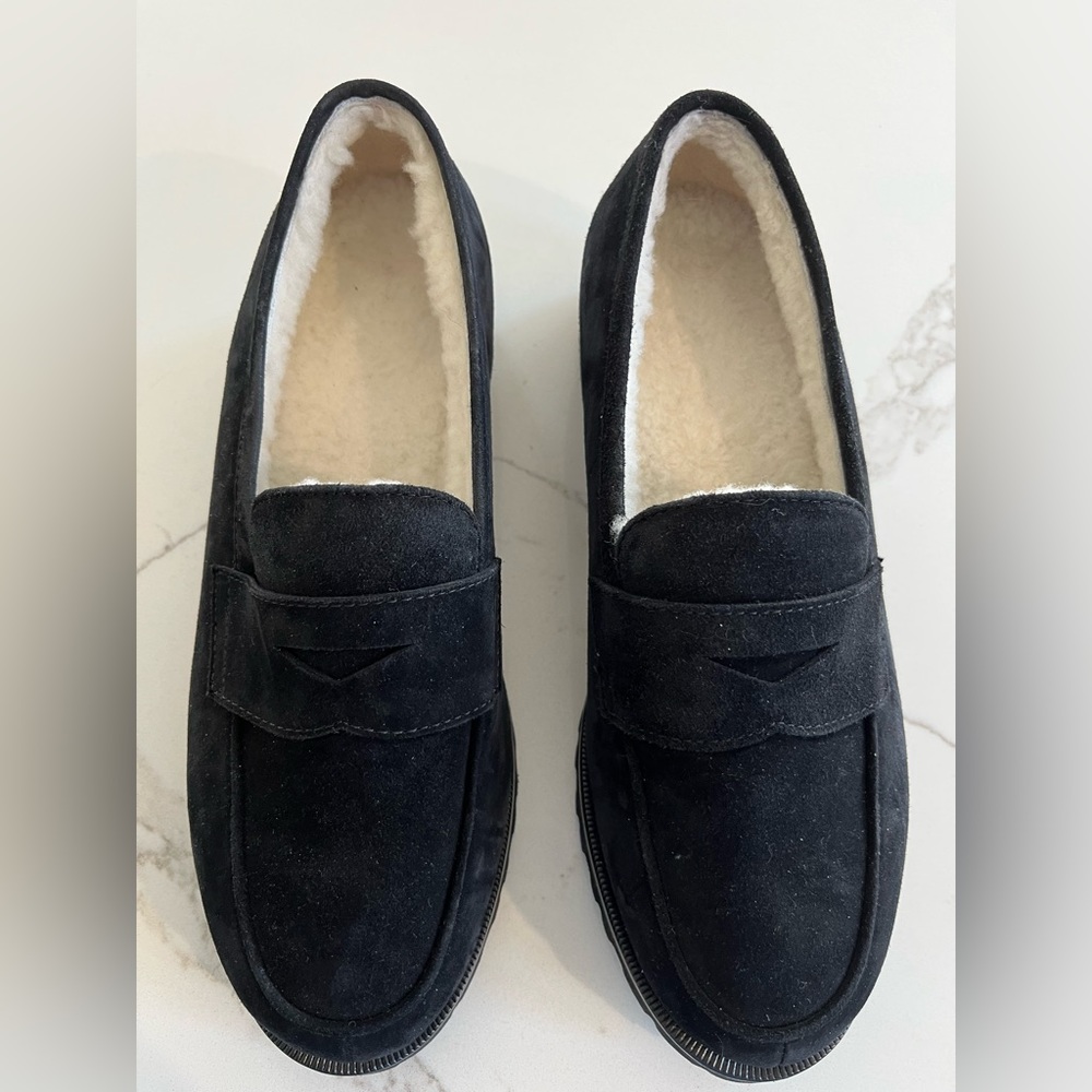Brand new, never worn unutzer mules with fleece insides. Suede black outside.